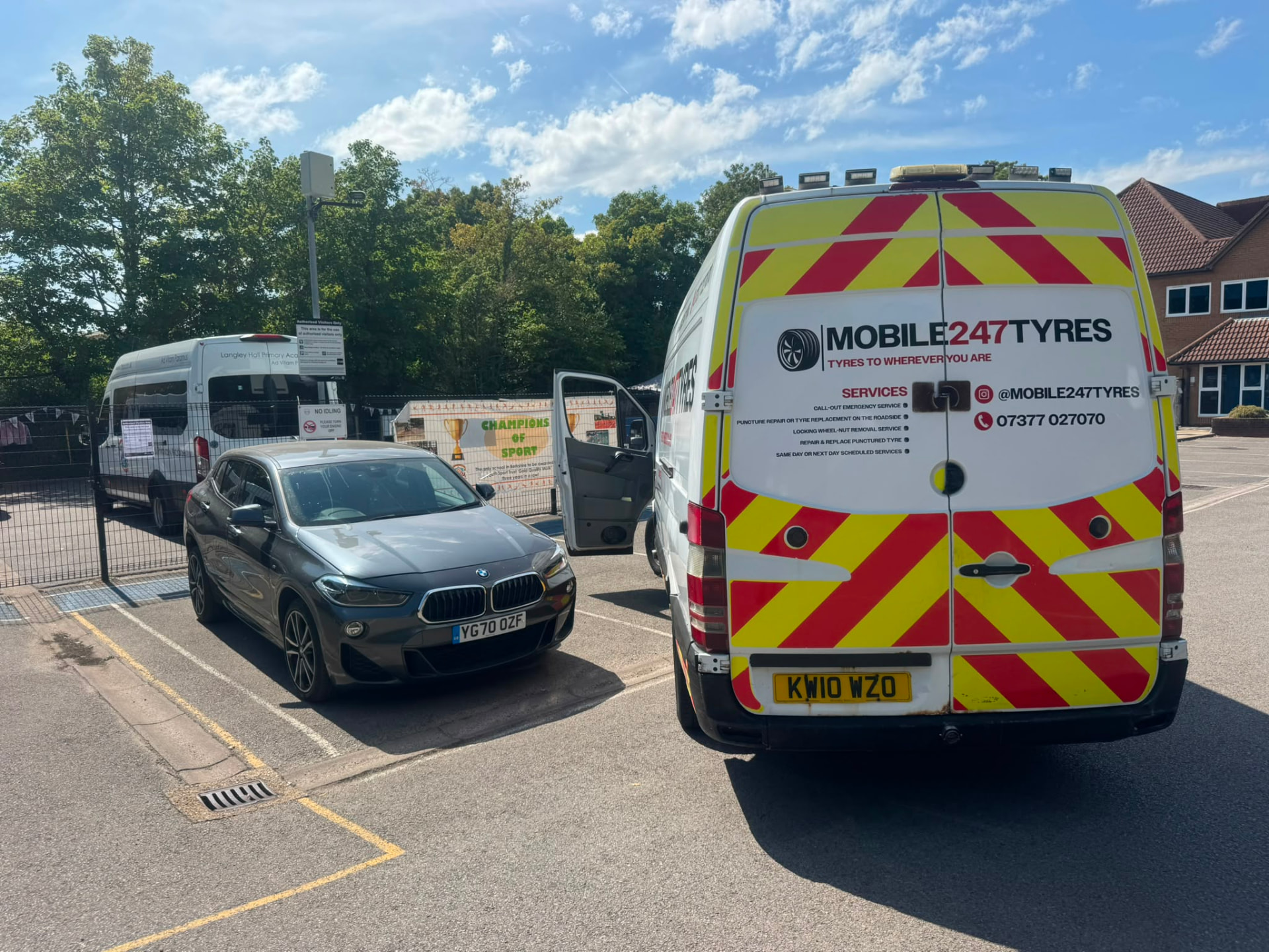 Mobile 247 Tyres van fitting a tyre for a customer in Slough