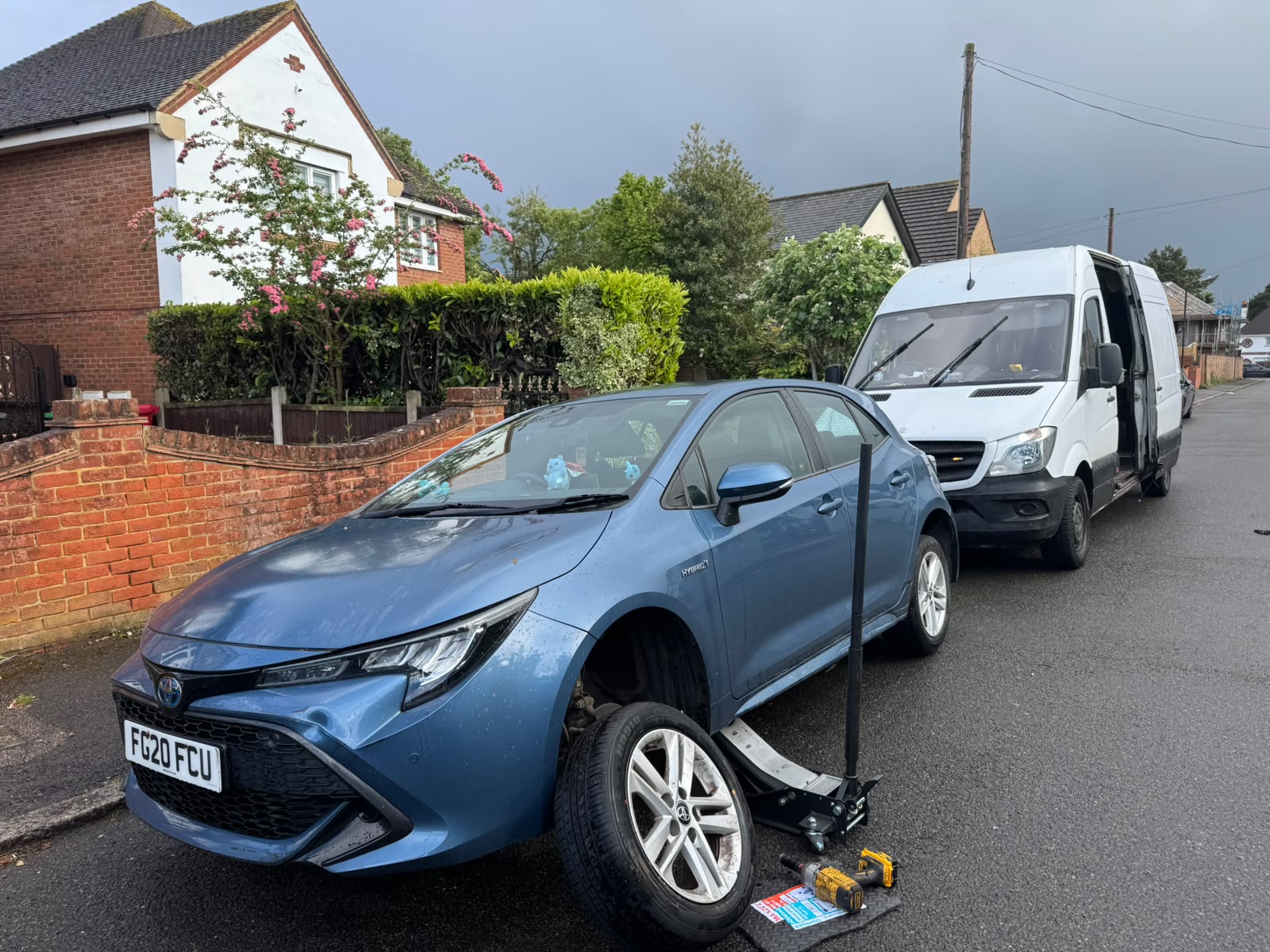Toyota Corolla hybrid having a tyre fitted on a residential street