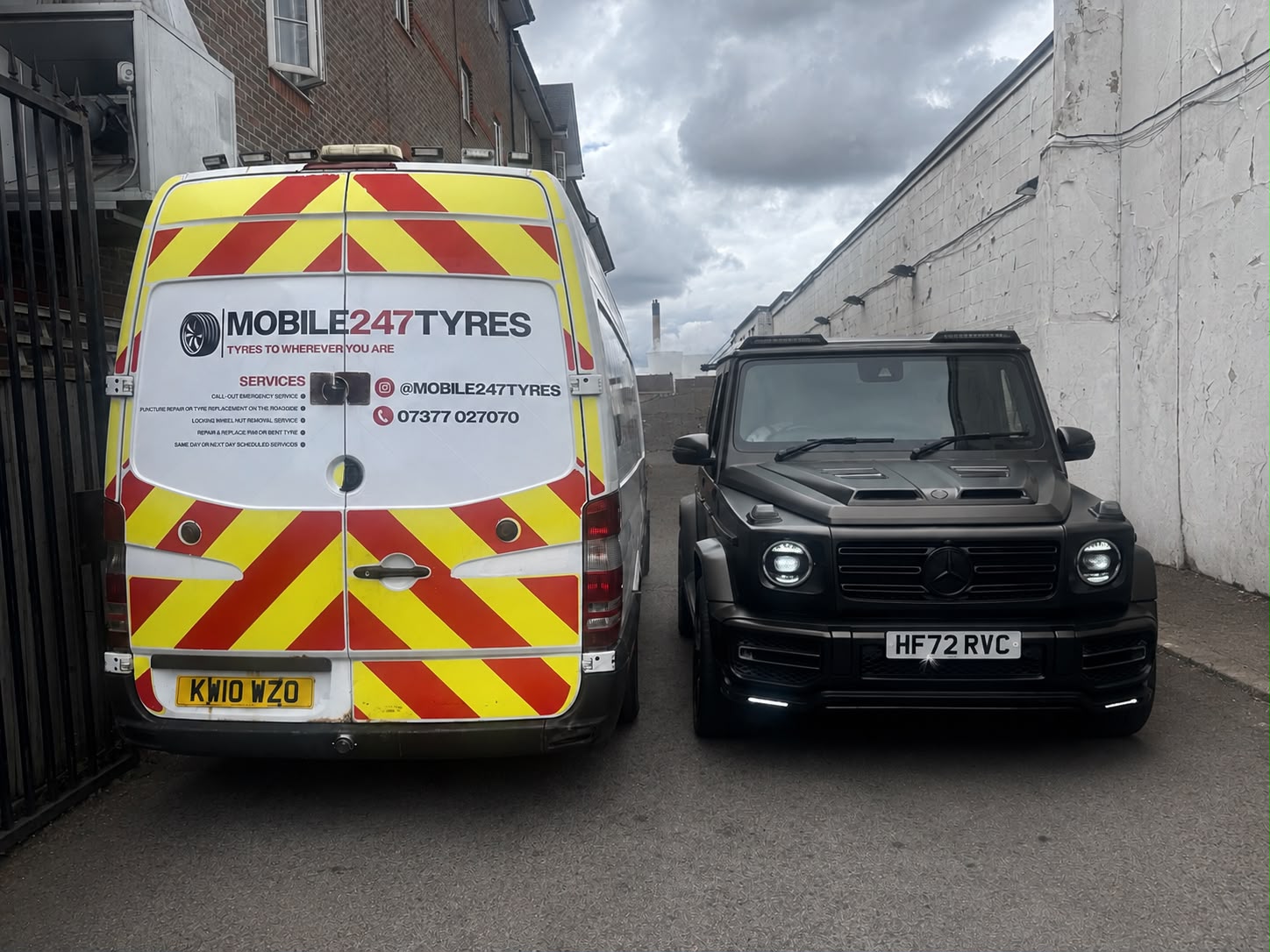 Mobile 247 Tyres van parked beside a customer vehicle in an alleyway