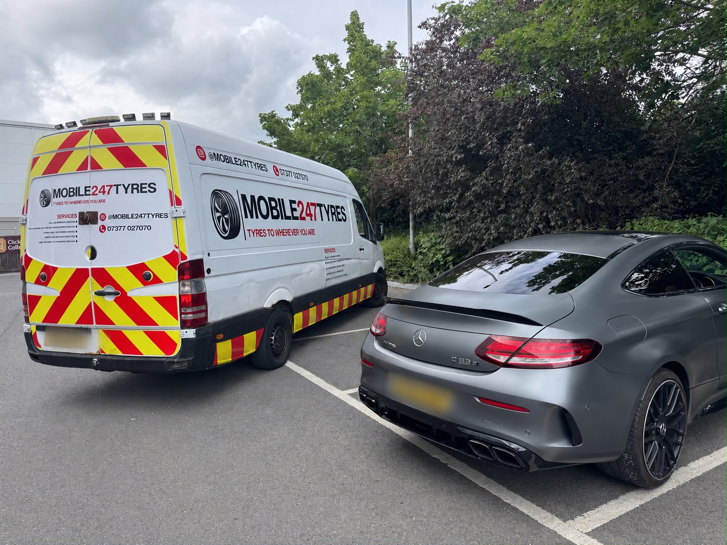 Mobile 247 Tyres van beside a Mercedes-AMG C63 in a car park